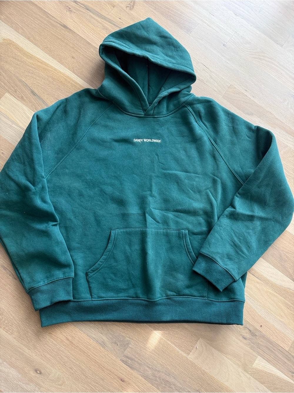 Deep Green Pullover Hoodie with Subtle Chest Logo